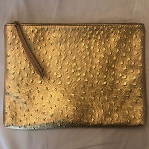 Gold leather clutch